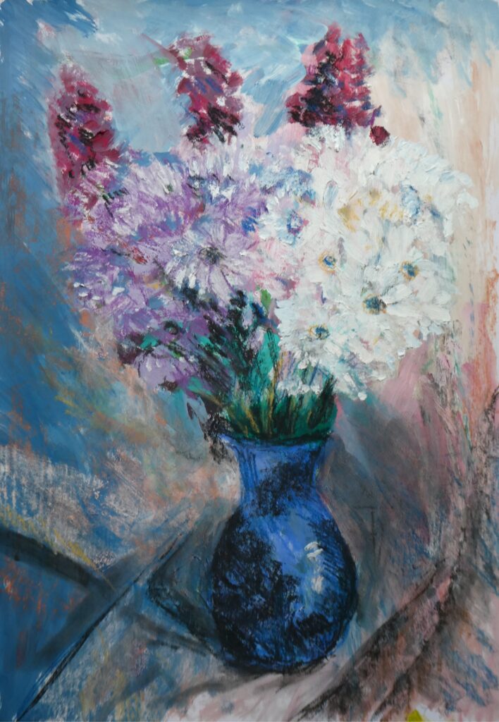 Mixed flowers in blue vase