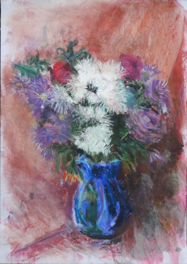 Dying flowers in blue vase